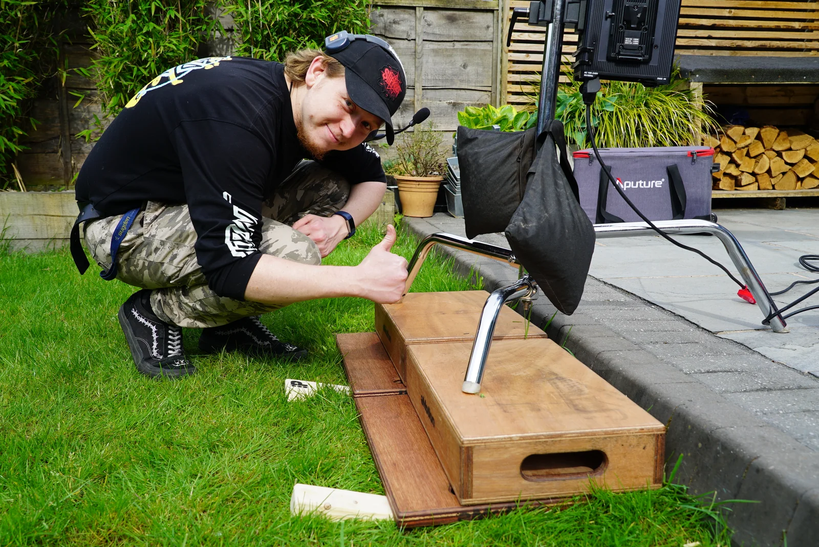 A crew member giving a thumbs-up beside the sound equipment